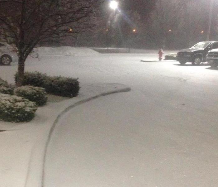 Snowfall in parking lot in Michigan